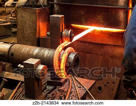 Red hot metal being made into a spring View Large Photo Image Picture - Red hot metal being made into a spring. Fotosearch