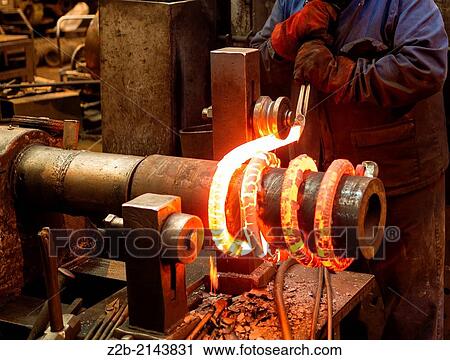 Red hot metal being made into a spring View Large Photo Image Stock Image - Red hot metal being made into a spring. Fotosearch