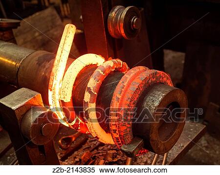 Red hot metal being made into a spring View Large Photo Image Stock Photography - Red hot metal being made into a spring. Fotosearch