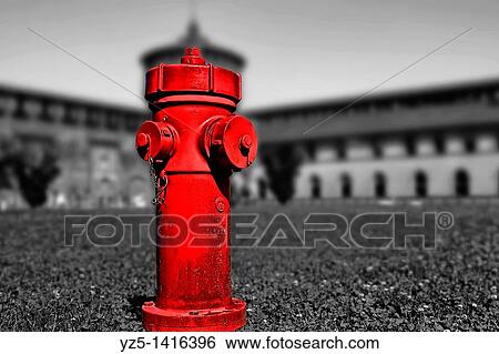 Stock Photograph - Red in castle, a standpipe in the garden of Castello Sforzesco, Milano, Italy. Fotosearch