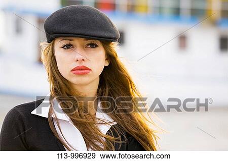 Stock Photo - Red lips, blowing wind, attractive young woman portrait. Fotosearch