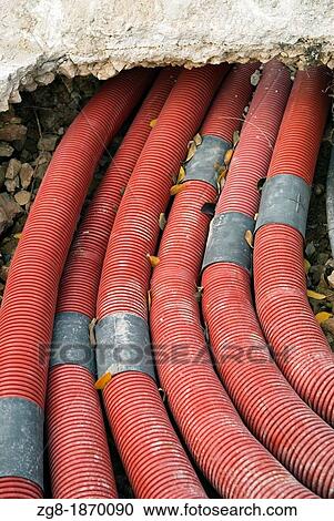 Red pipes under the pavement, public works, Denia, Alicante, Spain View Large Photo Image Stock Image - Red pipes under the pavement, public works, Denia, Alicante, Spain. Fotosearch