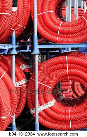 Red plastic tubing for construction View Large Photo Image Picture - Red plastic tubing for construction. Fotosearch