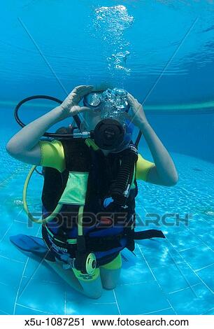 Stock Image - Red Sea, Egypt Roan Edelman aged 8 learning to dive in the pool. Fotosearch