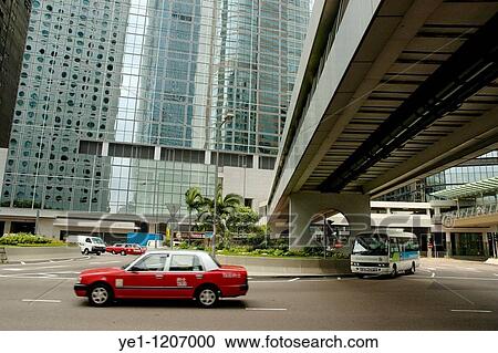 Red taxicab driving past modern skyscrapers, Hong Kong Island, Hong Kong, China. View Large Photo Image Stock Image - Red taxicab driving past modern skyscrapers, Hong Kong Island, Hong Kong, China.. Fotosearch