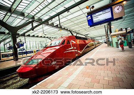 Stock Image - Red Thalys TGV stopped at Rotterdam Centraal Station, Holland.. Fotosearch