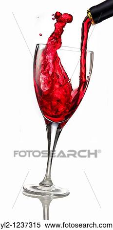 Red wine being poured into a glass View Large Photo Image Stock Photography - Red wine being poured into a glass. Fotosearch