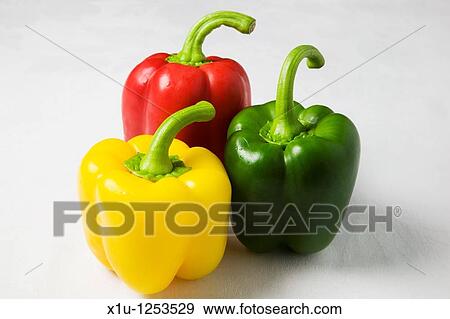 Stock Photo - Red Yellow and Green Peppers on a White Background. Fotosearch
