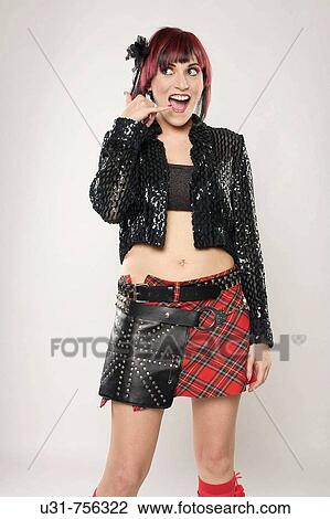Redhaired rocker girl pretending to be talking on the phone View Large Photo Image Stock Image - Redhaired rocker girl pretending to be talking on the phone. Fotosearch