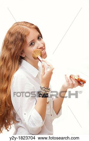 redheaded girl putting on makeup. View Large Photo Image Picture - redheaded girl putting on makeup.. Fotosearch
