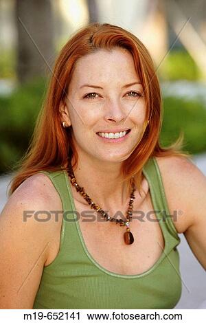Redheaded girl with green eyes View Large Photo Image Stock Image - Redheaded girl with green eyes. Fotosearch