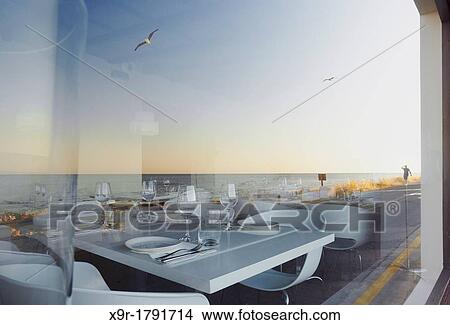 Reflected sea on a restaurant's window Denia Alicante Spain View Large Photo Image Picture - Reflected sea on a restaurant's window Denia Alicante Spain. Fotosearch