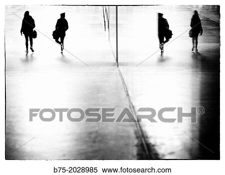 reflection in a glass of two unrecognizable people walking View Large Photo Image Stock Photography - reflection in a glass of two unrecognizable people walking. Fotosearch