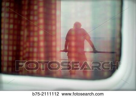 Reflection in a window of a passenger boat of a man leaning on the railing of the deck overlooking the sea. View Large Photo Image Stock Image - Reflection in a window of a passenger boat of a man leaning on the railing of the deck overlooking the sea.. Fotosearch