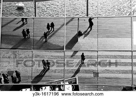 Reflection in the glass facade of the Maremagnum mall, Port Vell, Barcelona, Catalonia, Spain View Large Photo Image Stock Photograph - Reflection in the glass facade of the Maremagnum mall, Port Vell, Barcelona, Catalonia, Spain. Fotosearch