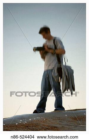 Reflection of a photographer View Large Photo Image Picture - Reflection of a photographer. Fotosearch