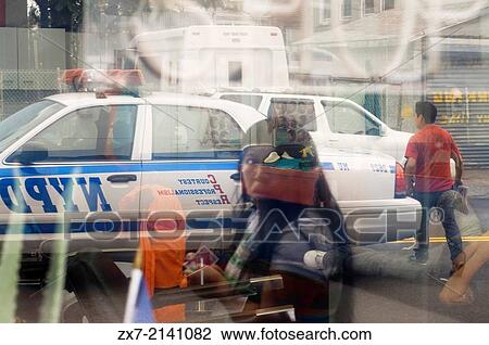 Reflection of a police car in Queens showcase. Queens is the largest neighborhood in New York View Large Photo Image Stock Image - Reflection of a police car in Queens showcase. Queens is the largest neighborhood in New York. Fotosearch