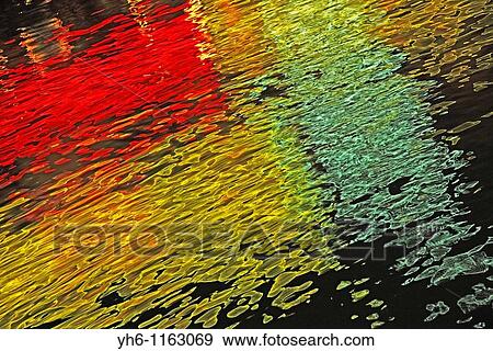 Stock Photo - Reflection of neon-light on canal, France, Savoie, Annecy. Fotosearch