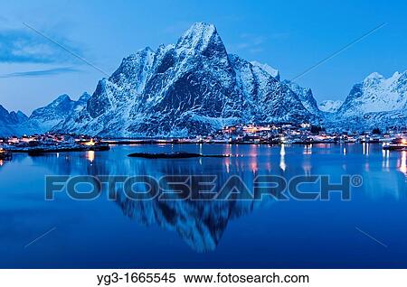 Reflection of Olstind mountain peak in harbour at Reine, Lofoten Islands, Norway View Large Photo Image Stock Photography - Reflection of Olstind mountain peak in harbour at Reine, Lofoten Islands, Norway. Fotosearch