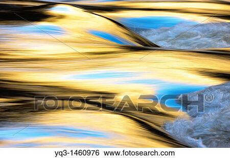 Stock Photograph - Reflections on Deva river as passing by La Hermida gorge, Cantabria, Spain. Fotosearch