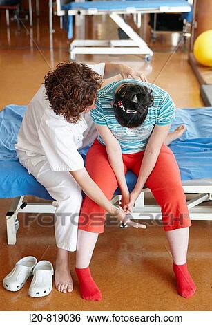 Rehabilitation exercises, anoxic encephalopathy due to bilateral thrombosis. Hospital Universitario de Gran Canaria Doctor Negrin, Las Palmas de Gran Canaria. Canary Islands, Spain View Large Photo Image Stock Photograph - Rehabilitation exercises, anoxic encephalopathy due to bilateral thrombosis. Hospital Universitario de Gran Canaria Doctor Negrin, Las Palmas de Gran Canaria. Canary Islands, Spain. Fotosearch