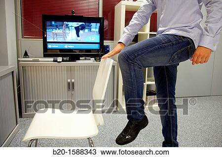 Stock Image - Rehabilitation exercises using videos. Fotosearch