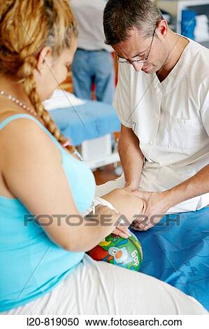 Rehabilitation, massaging amputated leg. Hospital Universitario de Gran Canaria Doctor Negrin, Las Palmas de Gran Canaria. Canary Islands, Spain View Large Photo Image Stock Image - Rehabilitation, massaging amputated leg. Hospital Universitario de Gran Canaria Doctor Negrin, Las Palmas de Gran Canaria. Canary Islands, Spain. Fotosearch