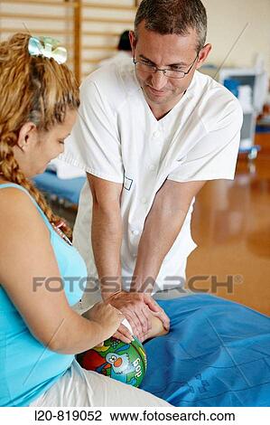 Rehabilitation, massaging amputated leg. Hospital Universitario de Gran Canaria Doctor Negrin, Las Palmas de Gran Canaria. Canary Islands, Spain View Large Photo Image Stock Image - Rehabilitation, massaging amputated leg. Hospital Universitario de Gran Canaria Doctor Negrin, Las Palmas de Gran Canaria. Canary Islands, Spain. Fotosearch