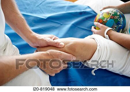 Stock Photo - Rehabilitation, massaging amputated leg. Hospital Universitario de Gran Canaria Doctor Negrin, Las Palmas de Gran Canaria. Canary Islands, Spain. Fotosearch