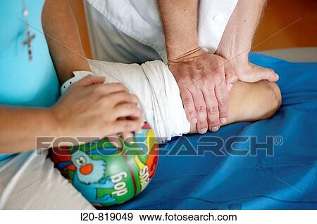 Stock Photo - Rehabilitation, massaging amputated leg. Hospital Universitario de Gran Canaria Doctor Negrin, Las Palmas de Gran Canaria. Canary Islands, Spain. Fotosearch