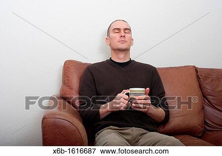 relaxed forty year old man in casual setting View Large Photo Image Stock Photo - relaxed forty year old man in casual setting. Fotosearch
