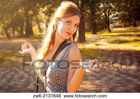 Stock Photo - Relaxed girl in the wood. Fotosearch
