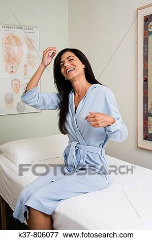 Stock Photo - Relaxed & smiling woman after Acupuncture. Fotosearch