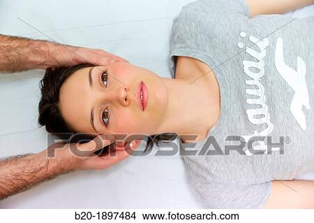 Picture - Relaxing facial massage therapy Gym Physiotherapy medical center, Donostia, San Sebastian, Gipuzkoa, Basque Country, Spain. Fotosearch