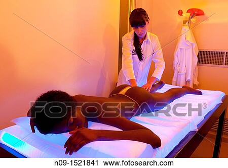 Stock Image - Relaxing massage at a spa.. Fotosearch