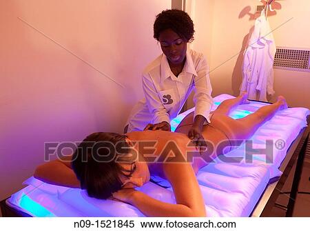 Relaxing massage at a spa. View Large Photo Image Stock Photography - Relaxing massage at a spa.. Fotosearch