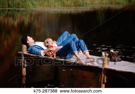 relaxing on a dock View Large Photo Image Stock Photo - relaxing on a dock. Fotosearch