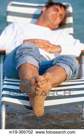 relaxing on at the beach View Large Photo Image Stock Image - relaxing on at the beach. Fotosearch