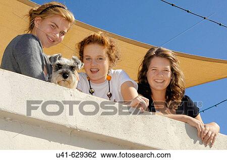 Relaxing on the sun deck with the dog View Large Photo Image Stock Image - Relaxing on the sun deck with the dog. Fotosearch