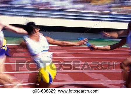 Relay race, delivering the staff. View Large Photo Image Stock Photo - Relay race, delivering the staff.. Fotosearch