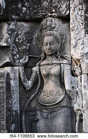 Stock Image - Relief of a Khmer Templedancer at the Bayon Temple in Angkor-Thom. Fotosearch