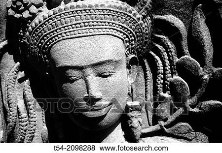 Stock Photo - Relief of a temple dancer in Ta Prohm temple in Angkor. Fotosearch