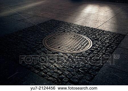 Remains of Warsaw Uprasing from 1944 against Nazi occupation. One of famous manhole using by insurgents, 53 Nowy Swiat street. View Large Photo Image Stock Photograph - Remains of Warsaw Uprasing from 1944 against Nazi occupation. One of famous manhole using by insurgents, 53 Nowy Swiat street.. Fotosearch