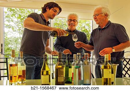 Remy Grassa tasting wines and armagnacs, with Mr Richard Clavaud from Suds concepts Publishing House and Mr Alain Bradfer wine writter, Domaine de Tariquet wines and armagnac estate, Euze, Gers, Midi-Pyrenees, France View Large Photo Image Stock Photo - Remy Grassa tasting wines and armagnacs, with Mr Richard Clavaud from Suds concepts Publishing House and Mr Alain Bradfer wine writter, Domaine de Tariquet wines and armagnac estate, Euze, Gers, Midi-Pyrenees, France. Fotosearch