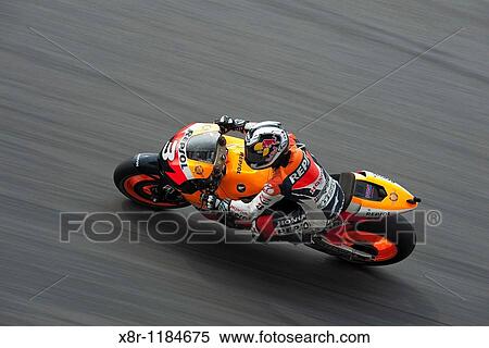 Repsol Honda Team rider Dani Pedrosa of Spain steers his Moto GP Honda during the Shell Advance Malasyan Motorcycle Grand Prix 2009 at the Sepang circuit on the outskirts of Kuala Lumpur, Malaysia. View Large Photo Image Stock Photography - Repsol Honda Team rider Dani Pedrosa of Spain steers his Moto GP Honda during the Shell Advance Malasyan Motorcycle Grand Prix 2009 at the Sepang circuit on the outskirts of Kuala Lumpur, Malaysia.. Fotosearch