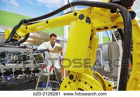 Stock Image - Research and development for the design of robotic manufacturing cell to work in aircraft component.. Fotosearch