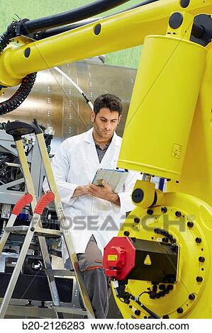 Stock Image - Research and development for the design of robotic manufacturing cell to work in aircraft component. Industry and Transport. Research & innovation.. Fotosearch
