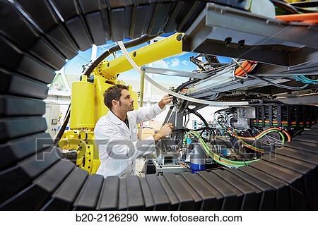 Stock Image - Research and development for the design of robotic manufacturing cell to work in aircraft component. Industry and Transport. Research & innovation.. Fotosearch