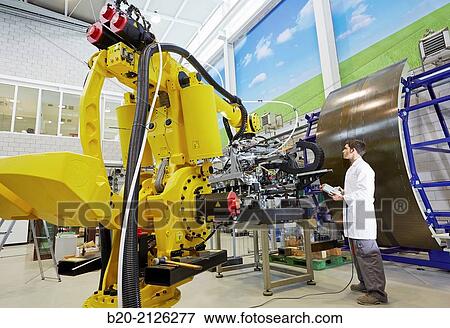 Stock Photo - Research and development for the design of robotic manufacturing cell to work in aircraft component.. Fotosearch