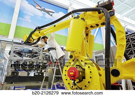 Stock Photo - Research and development for the design of robotic manufacturing cell to work in aircraft component.. Fotosearch